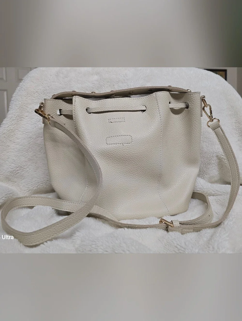 Cream Pebbled Leather Drawstring Shoulder Bucket Bag with Gold Accents